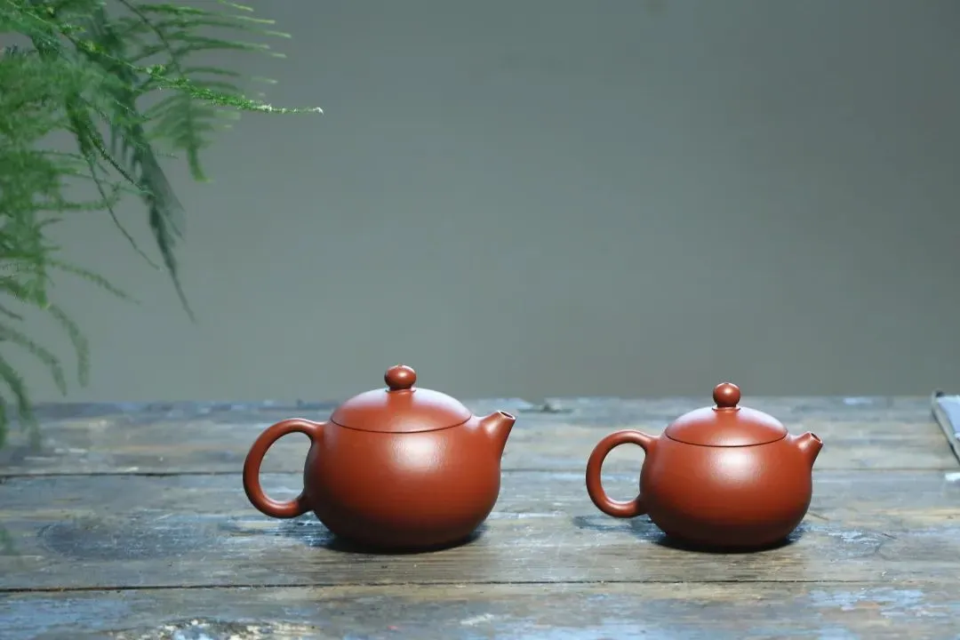 Circular purple clay teapot