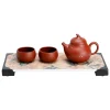 Full view of a Yixing Clay Gongfu Tea Set including a teapot, two teacups, and a bamboo-patterned tea tray, presented against a clean white background for product display