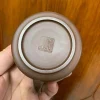 Bottom view of a Yixing Purple Clay Teapot from Yixing Zisha Tea Set, featuring an artisan seal, highlighting the craftsmanship of Yixing Tea Sets