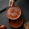 Detachable design of the Yixing Zhuni water storage tea tray, showing the double-layer water storage structure for easy cleaning and daily tea use