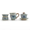 Porcelain Gaiwan Tea Set trio: gaiwan, fairness pitcher, and tea strainer, featuring cohesive blue and white floral artwork.