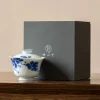 Dehua Porcelain Gaiwan with hand-painted blue floral patterns, displayed with a premium gift box for gifting.