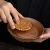 Placing a woven rattan mat inside an Unglazed Gaiwan tray, showcasing the tray’s versatility in tea ceremony