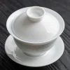 Complete Porcelain Gaiwan set, including bowl, lid, and saucer, adorned with delicate translucent rice pattern floral designs.