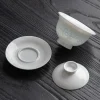 Disassembled Rice Pattern Gaiwan set, displaying the bowl, lid, and saucer of this premium porcelain gaiwan with translucent floral details.