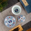 Disassembled Glazed Porcelain Gaiwan set, showing the detailed blue-red design inside the bowl and on the saucer.