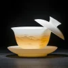 Mutton Fat Jade Gaiwan with translucent landscape relief, showcasing the milky white jade-like texture of this elegant gaiwan tea bowl under soft lighting.