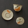 Cat Gaiwan three-piece set (bowl, lid, saucer) with hand-painted cat and persimmon patterns, ideal for traditional tea ceremonies.