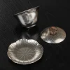 Disassembled Titanium Gaiwan set (bowl, lid, saucer), revealing the intricate lotus leaf pattern on the matching saucer.