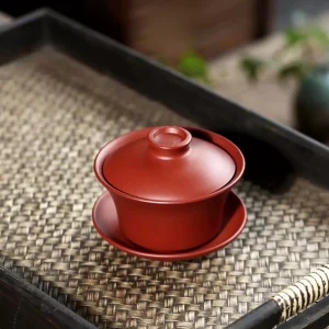 Complete Gongfu Gaiwan made of Yixing Purple Clay placed on woven tea tray